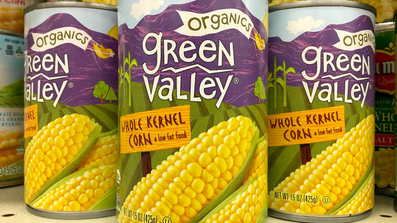 Three cans of whole kernal corn