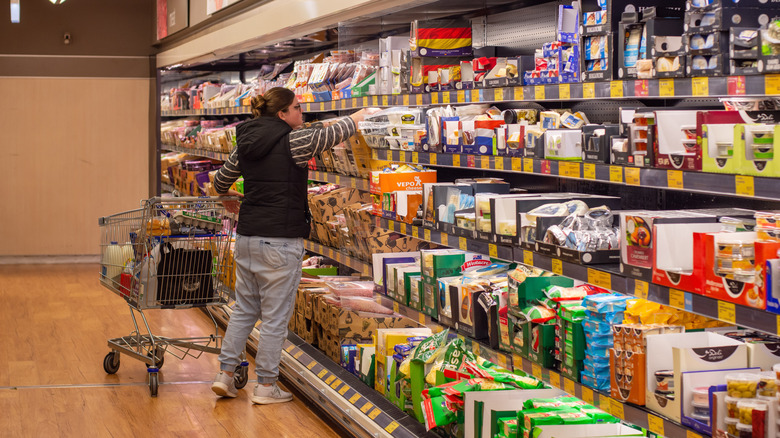 A woman shops at Aldi