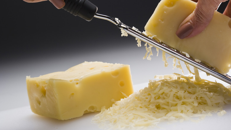 cheese being grated