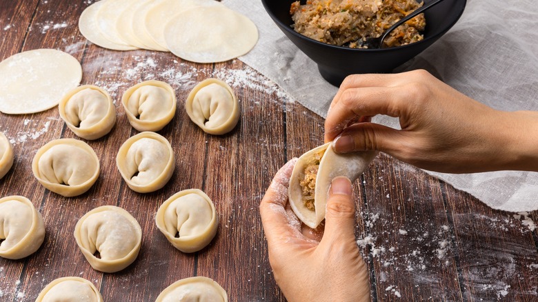 dumplings being made on table