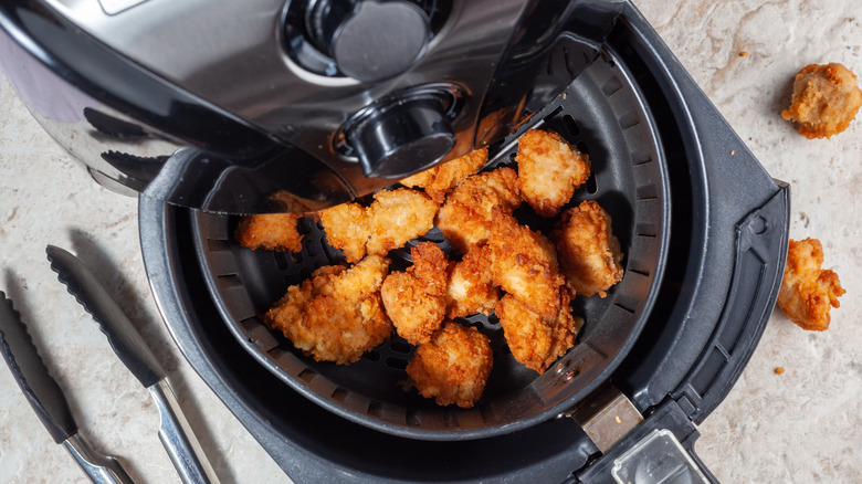 Chicken in an air fryer basket