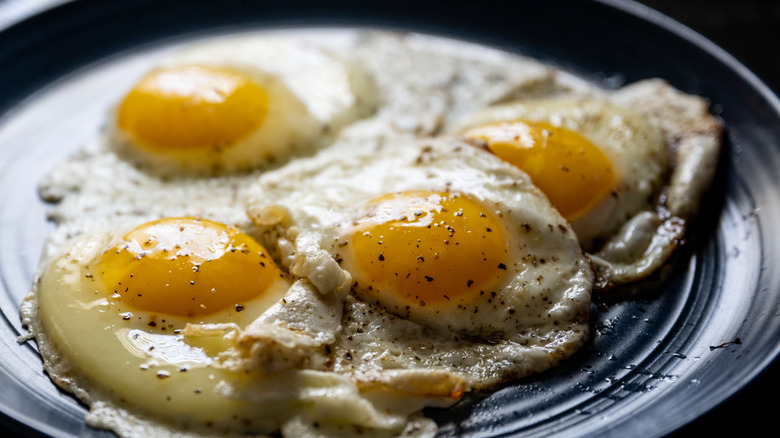 Fried eggs on a plate with spices