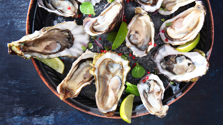 shucked oysters with pink peppercorn