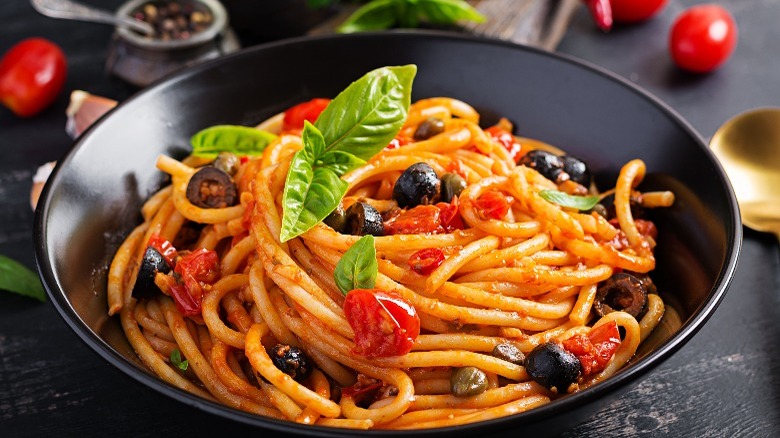 a bowl of spaghetti alla puttanesca