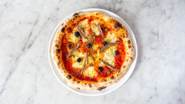 tomato-based pizza topped with anchovies