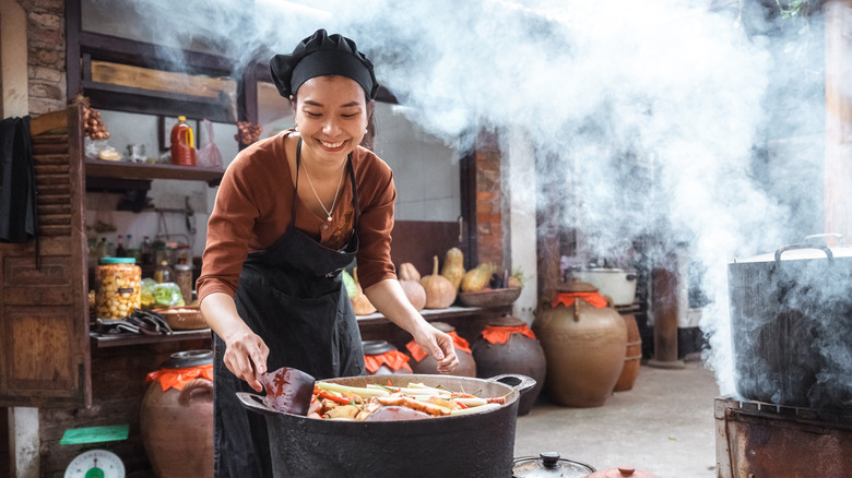 A chef steaming fish