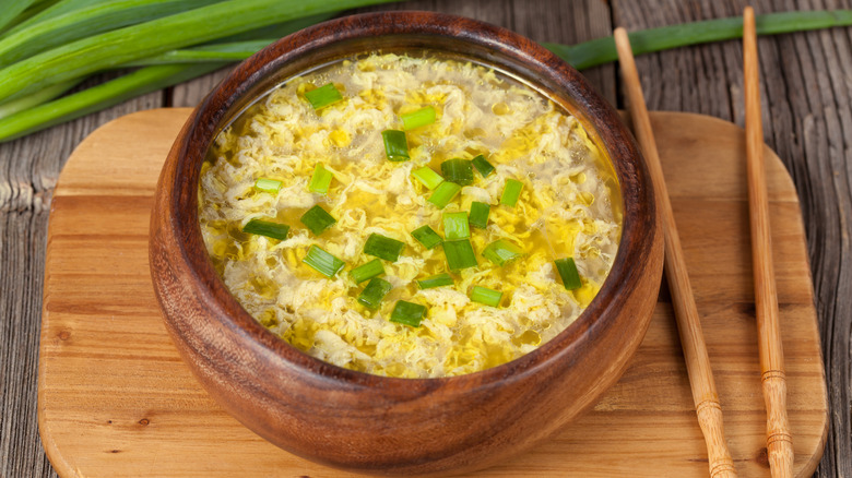 egg drop soup in wooden bowl from above