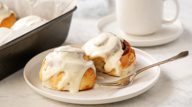 Iced cinnamon rolls on plate