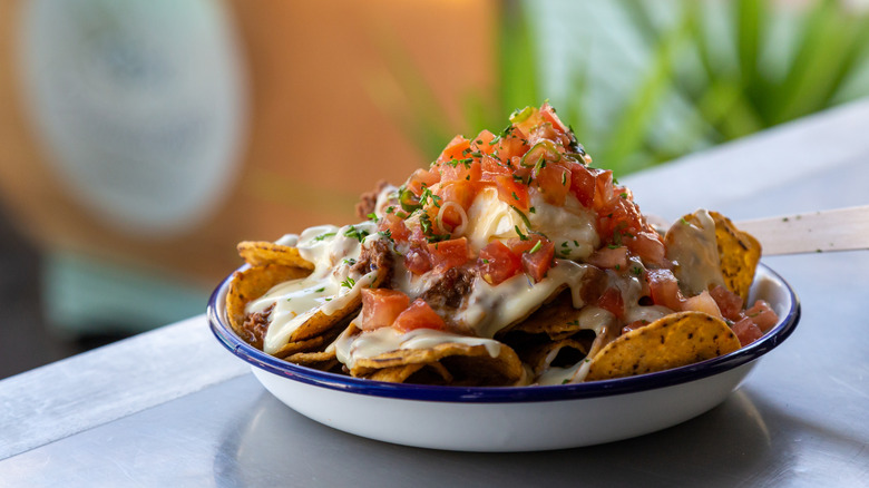 plate of nachos on table