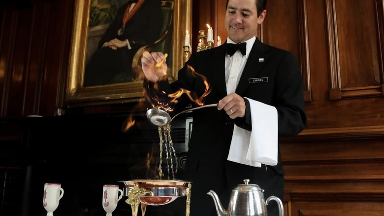 waiter preparing cafe brulot diabolique