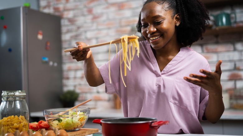 Person looking at cooked noodles