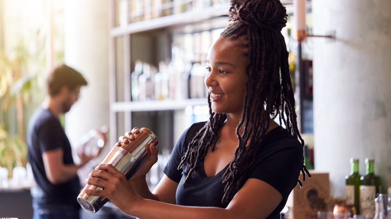 Woman shaking a cocktail