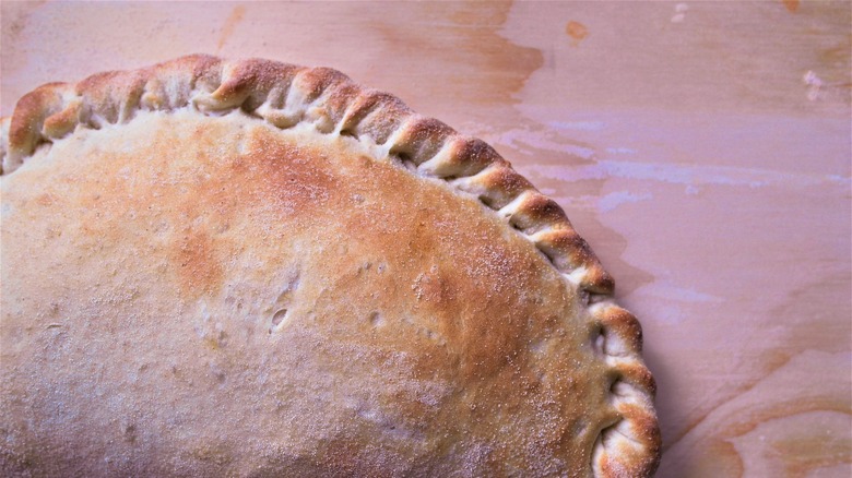 Plain calzone on a board