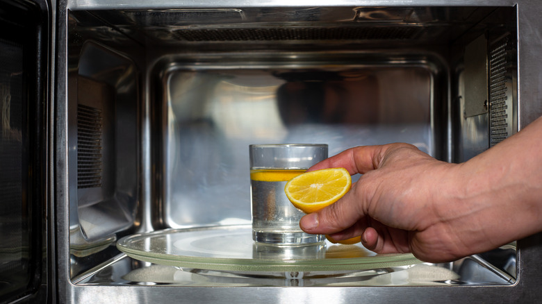 Glass and orange in microwave