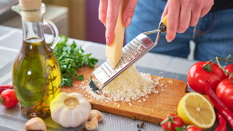 Person properly grating cheese