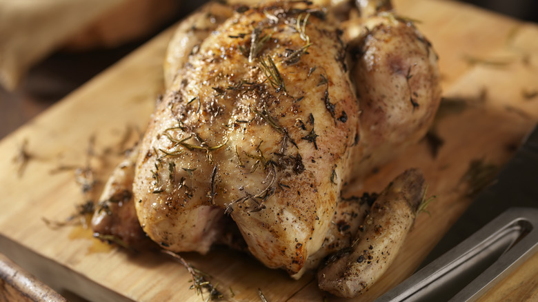 Roasted chicken on cutting board