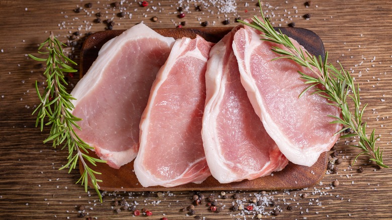 Raw pork chops with fat