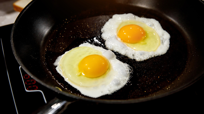 Scrambled eggs on frying pan