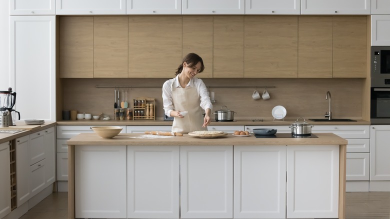 Woman baking in large kitchen