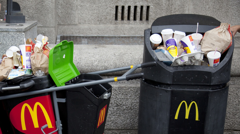 overflowing mcdonald's trash cans