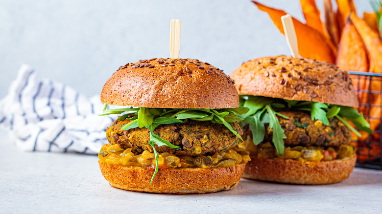 Two lentil burgers with sweet potato fries