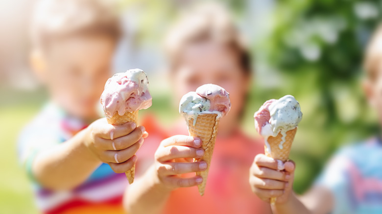 kids enjoying ice cream in the park