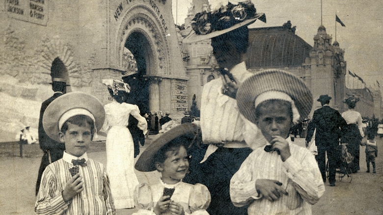 kids and woman enjoying ice cream cones