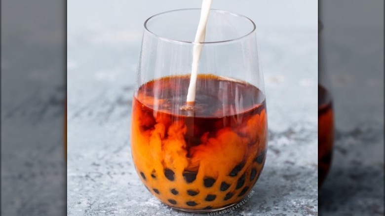 Thai tea boba being poured