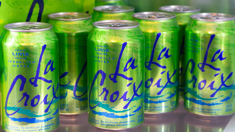 Several LaCroix lime sparkling water cans