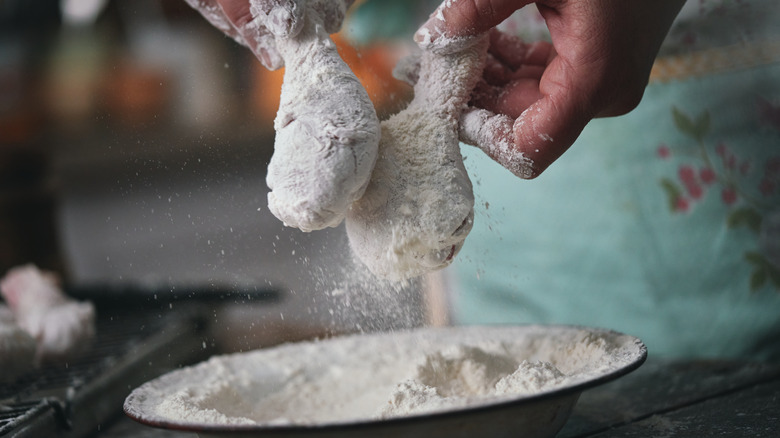 drumsticks being dredged in flour