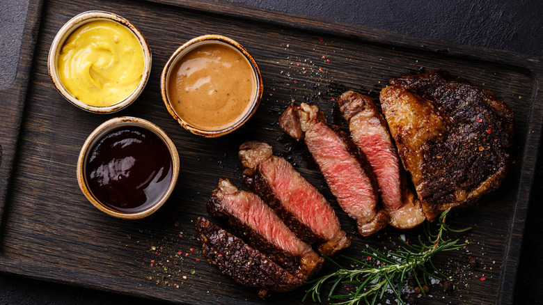 Steak served with sauces on the side