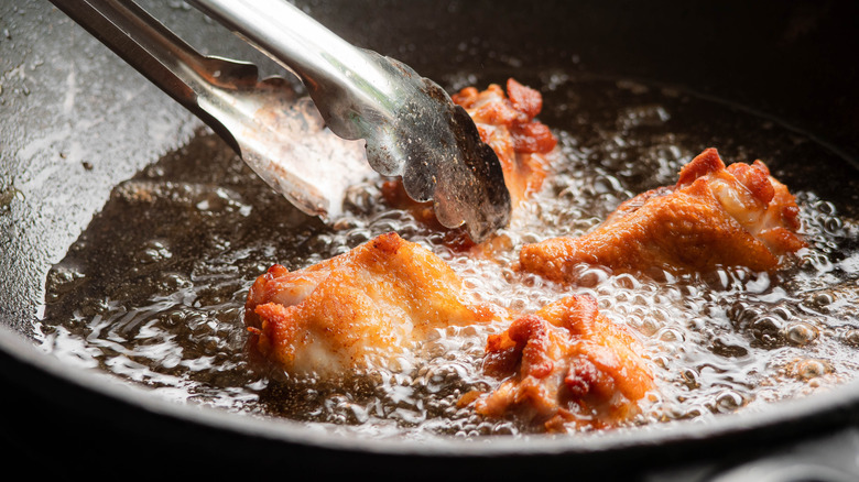 Chicken frying in oil