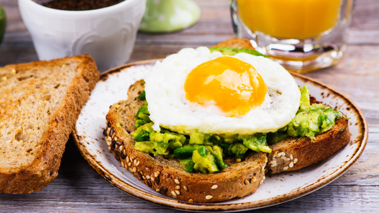 egg adorning avocado toast breakfast