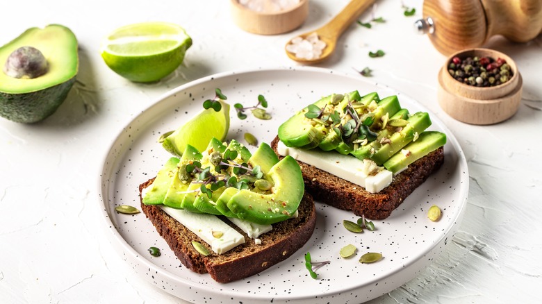 plate holding artisanal avocado toast