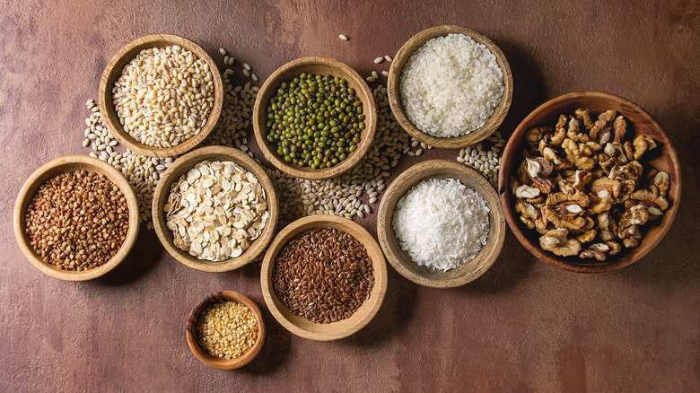 uncooked grains in wooden bowls