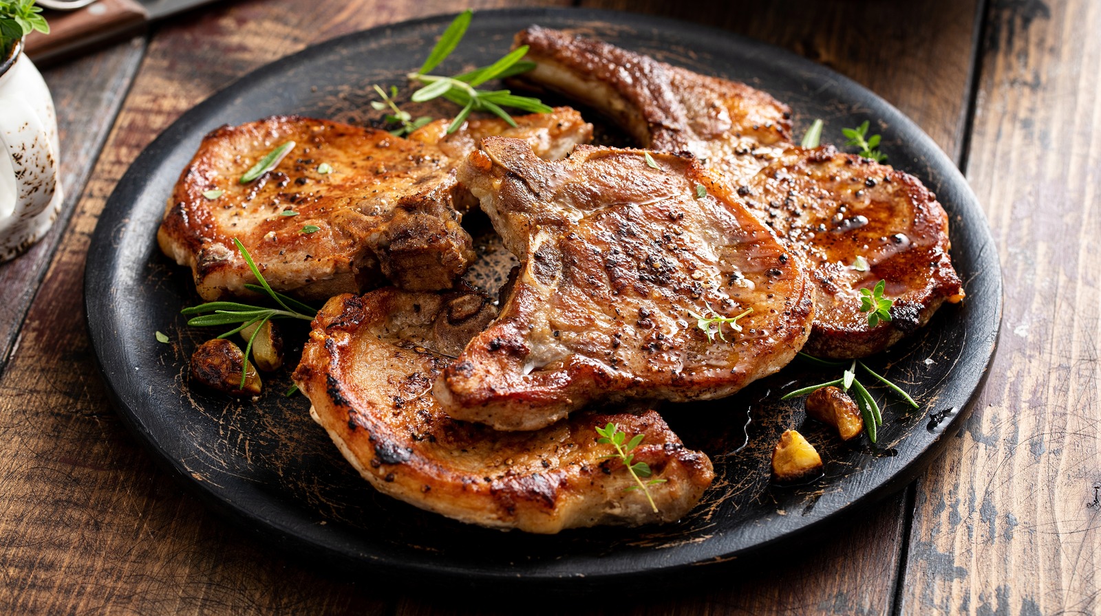 The Cooking Tip You Need For Perfectly Juicy Thin Pork Chops