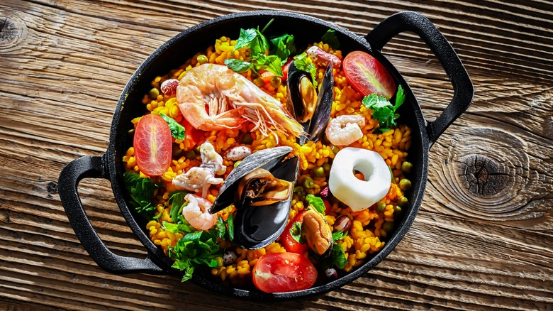 Seafood paella in cast iron pan