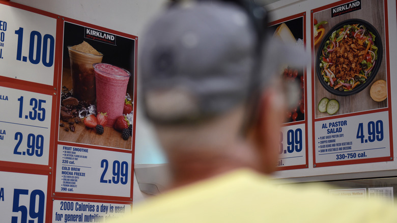 Man standing in Costco food court in America