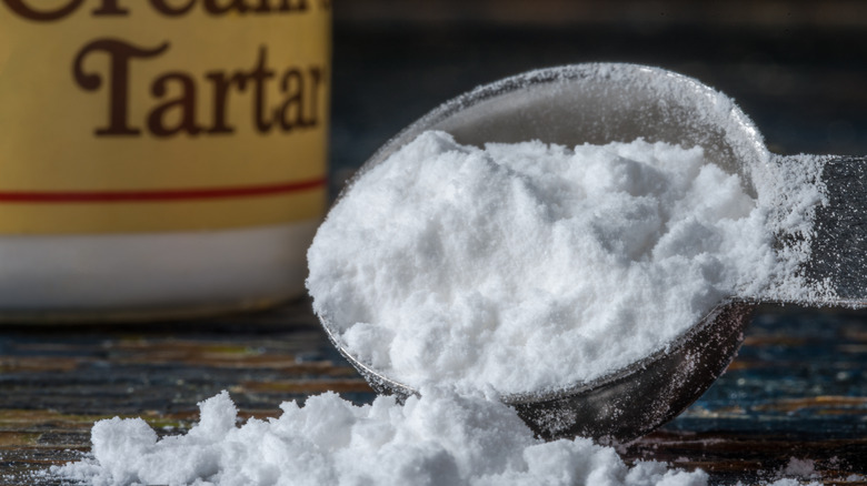 Cream of tartar in a measuring spoon