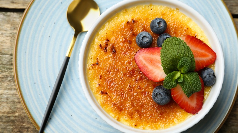 Creme brulee garnished with berries