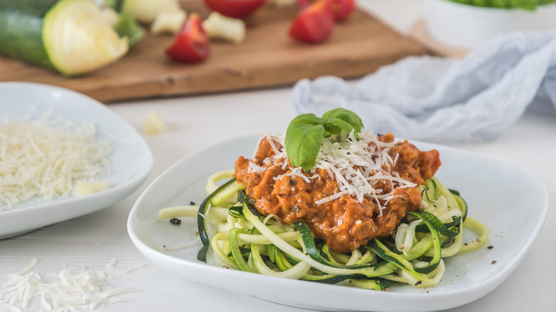 Zucchini bolognese on white plate