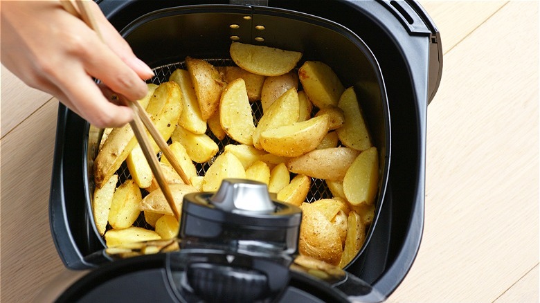 Sliced potatoes in open air fryer 