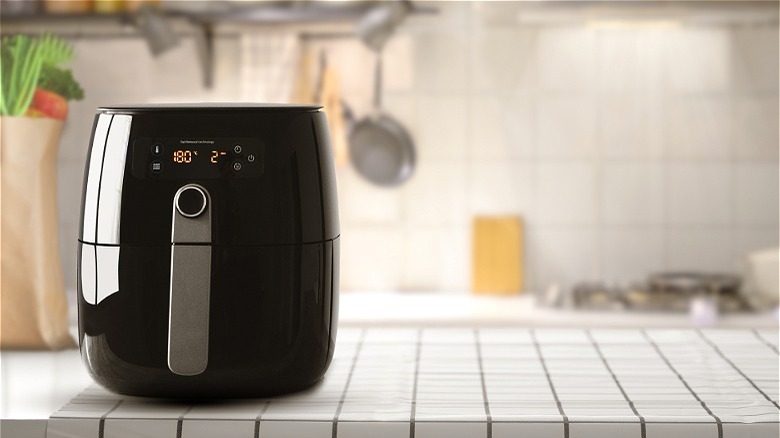 Black air fryer on kitchen counter 