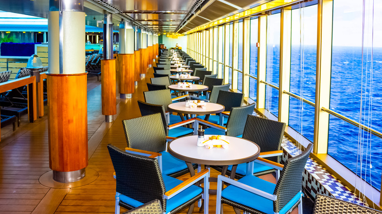 tables set in the buffet dining room on a cruise ship