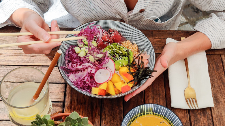 eating a poke bowl