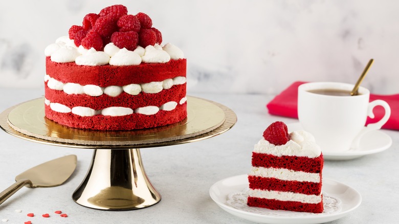 Red layered cake with cake slice