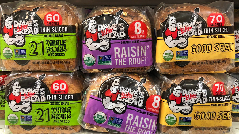 Loaves of Dave's Killer Bread on a grocery store shelf