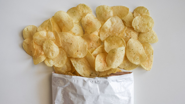 Chips falling out of a bag