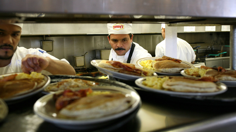 Denny's cooks set up plates