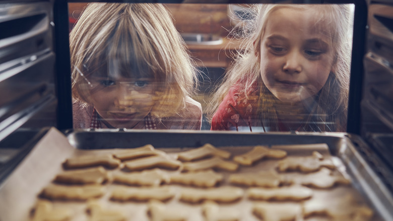 Kids watching cookies bake